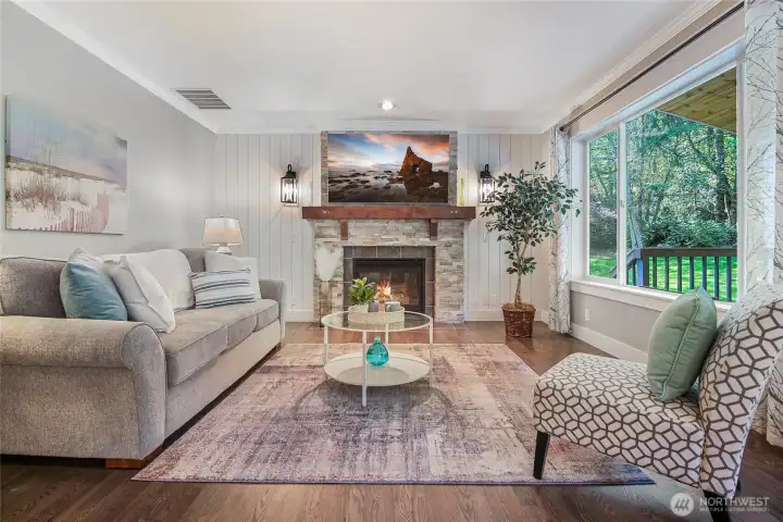 The family room offers a large window that views to the covered portion of the deck. A gas fireplace with fan keeps this area cozy on those cold days. Custom stonework and mantle add to the charm of this room. The room is wired for surround sound as well for your entertainment enjoyment.