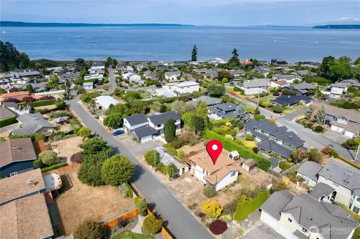 Level 10,890 SF property with Sound and Mountain views.