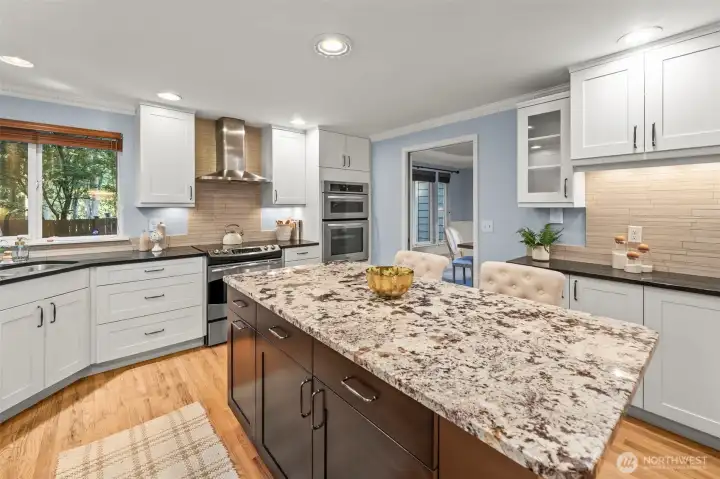 Additional cabinets (not shown in photo) flow along the right wall for pantry space.