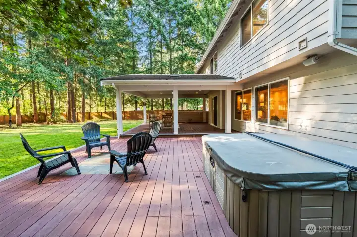Extended deck - the perfect spot to relax while surrounded by a private wooded backdrop.