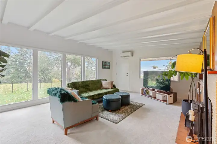 Floor to ceiling picture windows that bring in tons of natural light and exterior views. New carpets too!