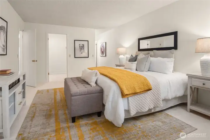 The primary bedroom features an expansive walk-in closet and en-suite bath with double sinks.