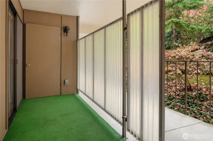 The front entry has another storage closet and more storage options behind the partition.