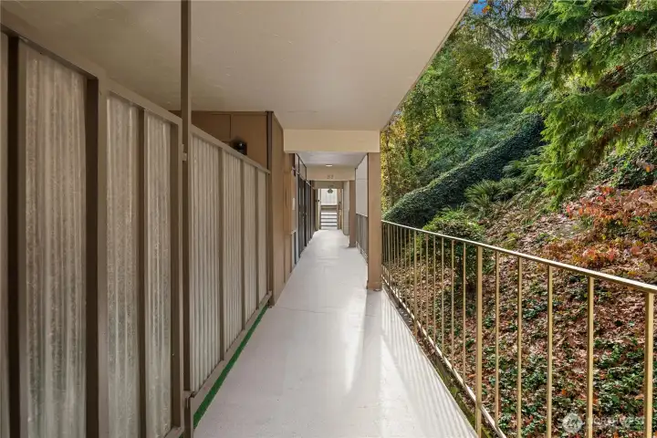 The access to the unit is through this protected hallway and just a few steps from the elevator.