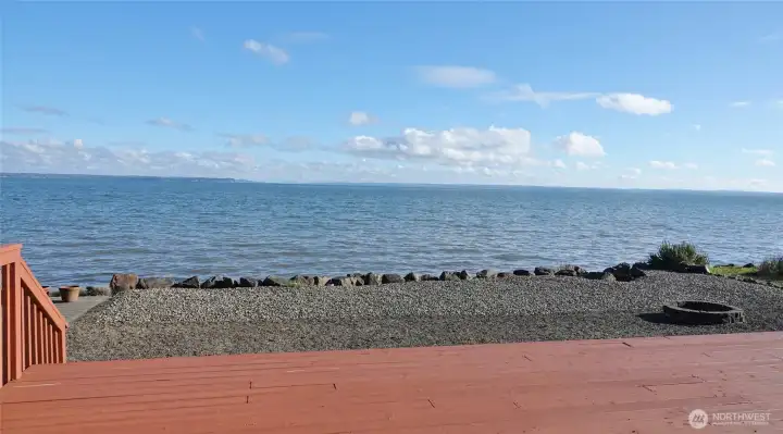 Step down from the large Deck to the level backyard and bulkheaded property.