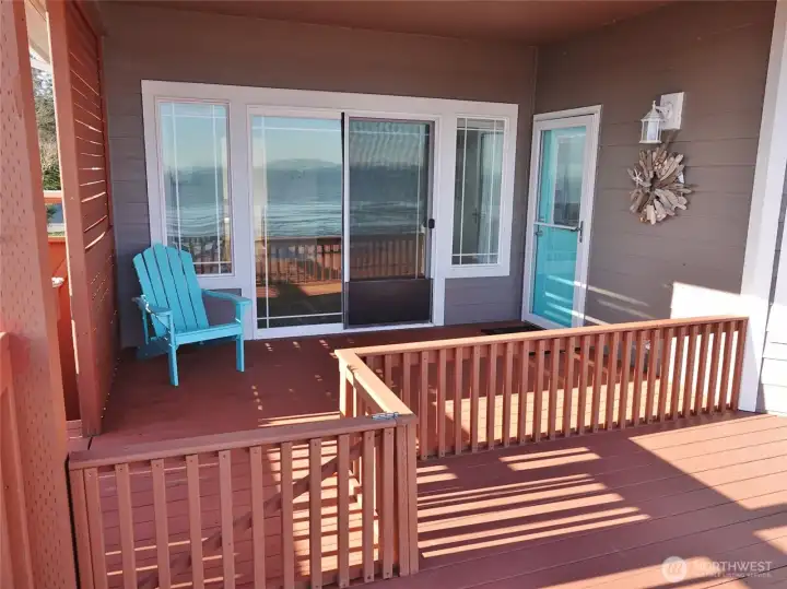 Door off the Great Room and a slider off the Master Bedroom to the covered south-side of the deck.   The fence was for the Owner's small dog.