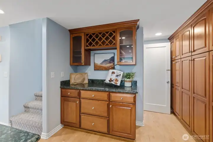 Wine bar and view of stairs going both up and downstairs.