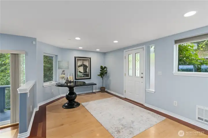 Oversized foyer (space for a piano?), coat closet and main floor powder room.