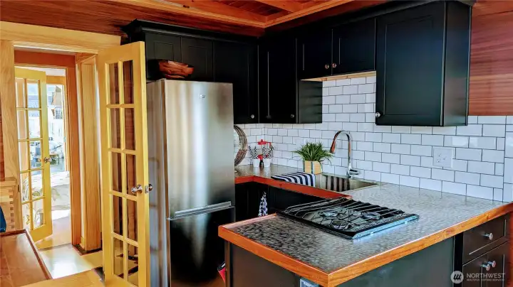 Full size appliances and hand-pounded steel counters