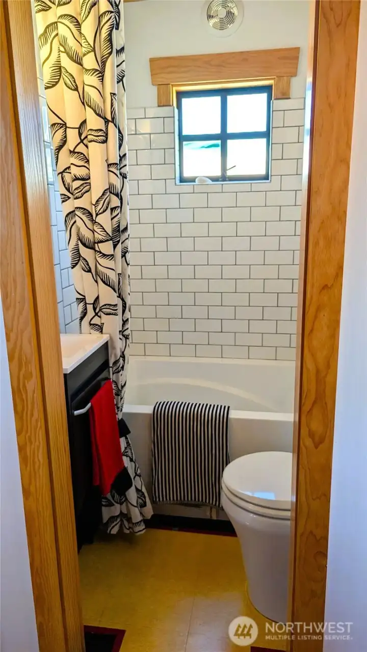 Full bath with deep soaking tub and tile surround