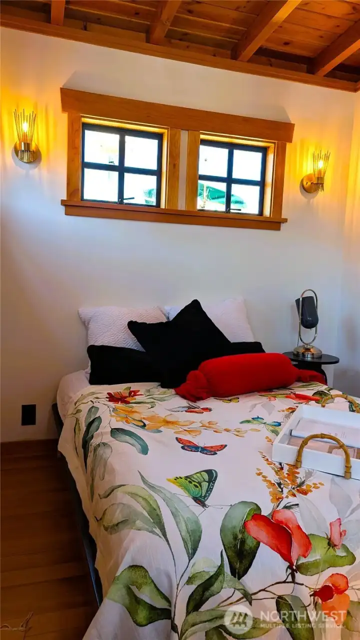 Bedroom fits a Queen bed, or possible have the builder build a custom built-in bed with storage underneath for an additional cost.