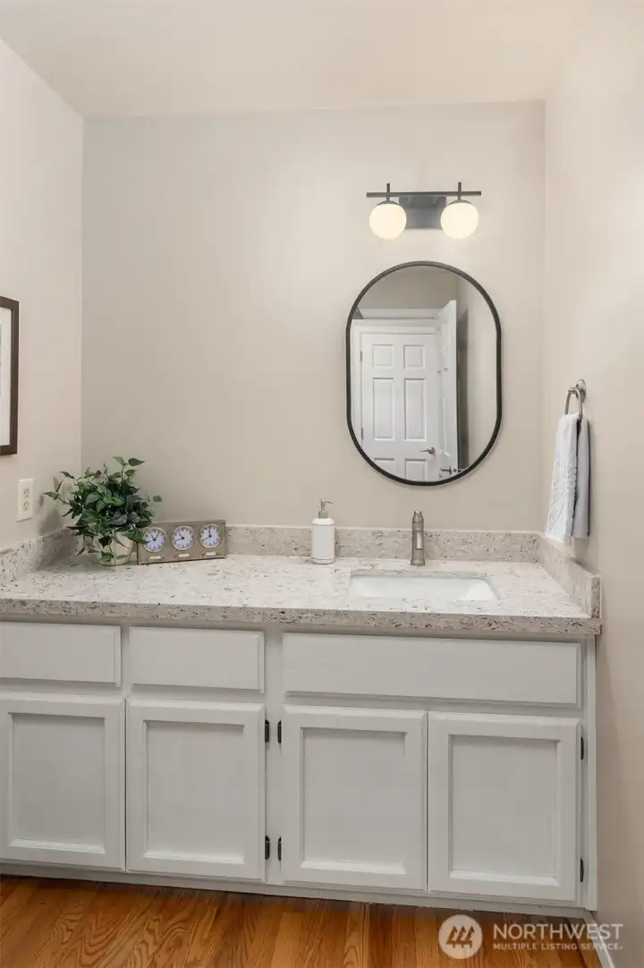 Main level powder room with new quartz countertop, faucet and sink.