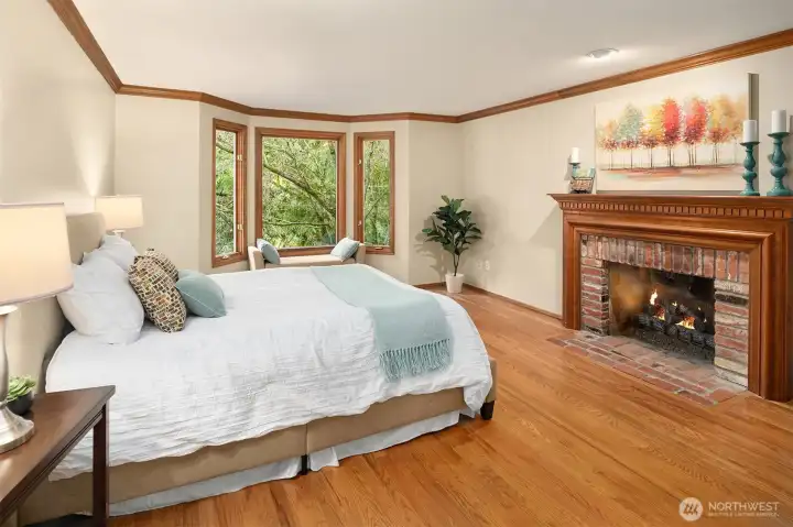 The oversized primary suite also houses a window seat, soaking tub, dual sink and separate tiled shower.