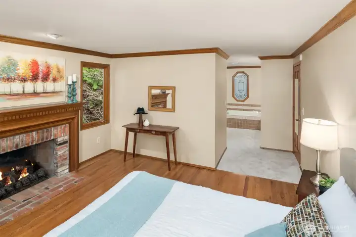 The oversized primary suite also houses a window seat, soaking tub, dual sink and separate tiled shower.