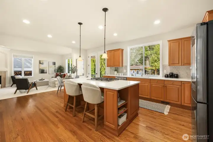 At the heart of the home, the chef’s kitchen features custom cabinetry, quartz counters, a generous island, and a butler’s pantry - seamlessly flowing into the family room for effortless entertaining.
