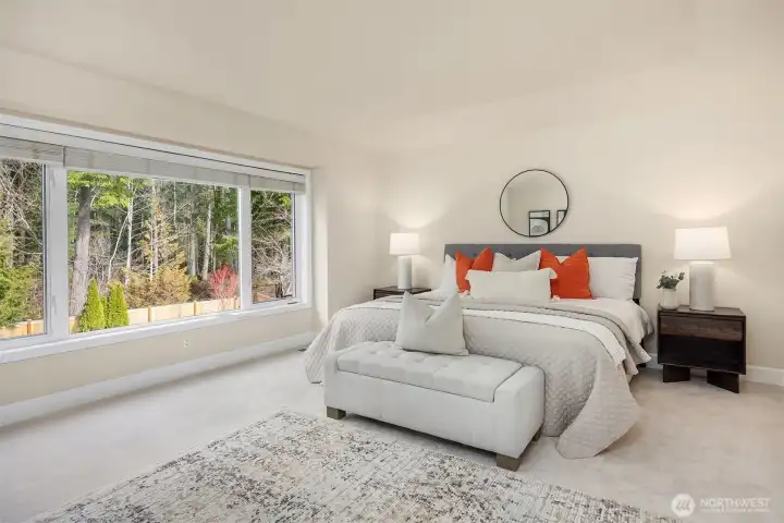 Upstairs, retreat to the sumptuous primary suite overlooking peaceful natural scenery, complete with a 5-piece ensuite, soaking tub, and a custom walk-in closet.