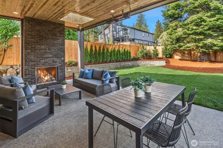 Covered entertainer’s patio w/built-in gas fireplace, overhead heaters, & TV prewiring