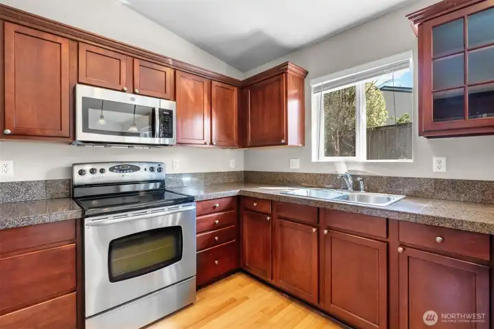 Natural light over the sink adds to the kitchen’s bright, easy feel