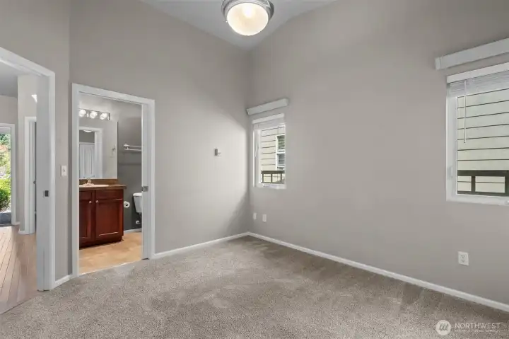 A comfortable bedroom with easy access to the nearby bath