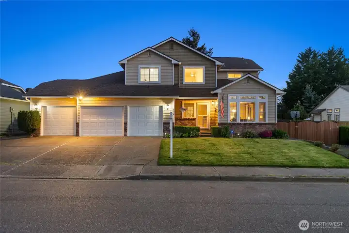 front of 3 car garage 4 bed 4 bath home