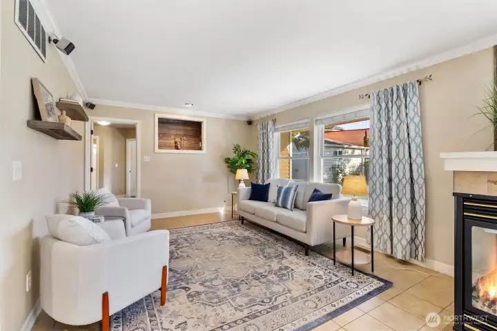 family room with fireplace diving from kitchen