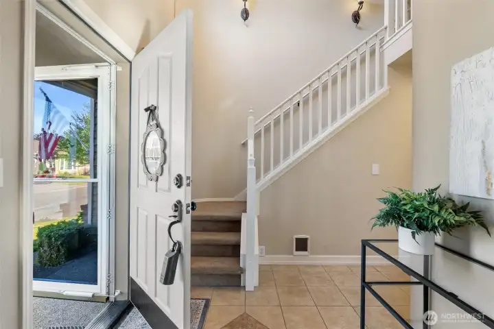 stairs to 2 bedrooms, 1 full bathroom and primary suite on second floor