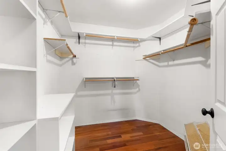 primary closet with built in shelving