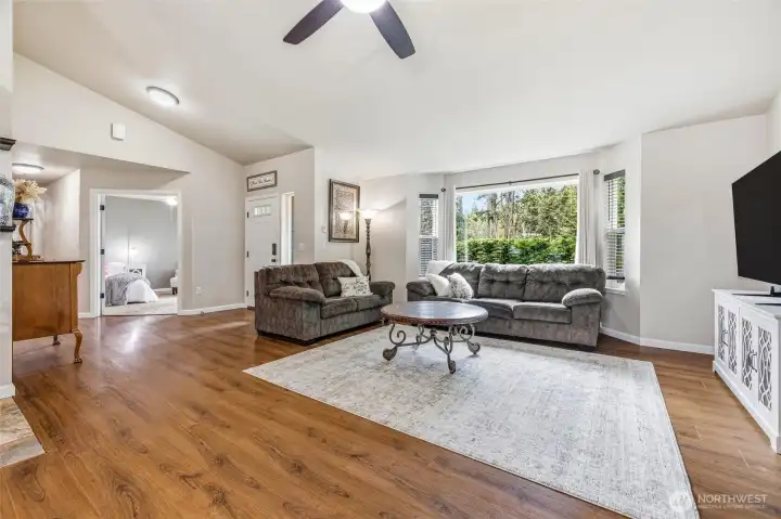 Enter into main living space which is bright an open. Door to left leads to office or as currently used the fourth bedroom option.