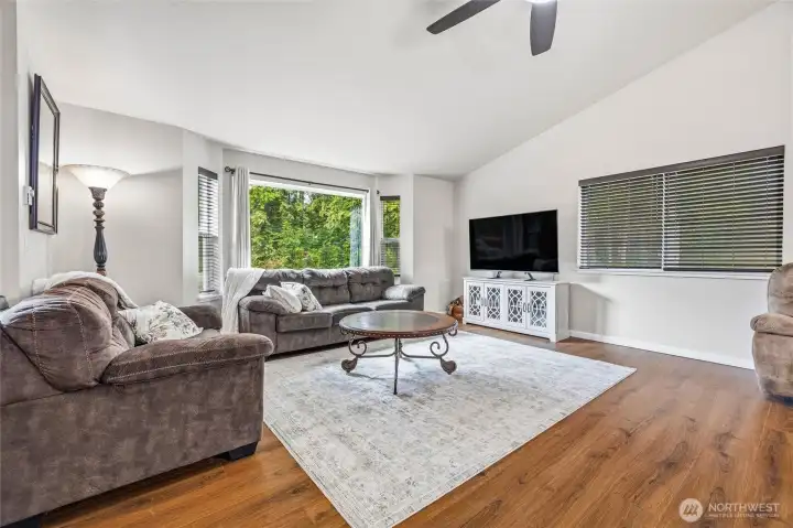 Tons of windows let in natural light and nature that surrounds home.