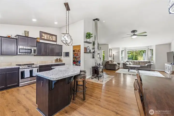 Kitchen, dining and living room all open. Vaulted ceilings. Laminate flooring throughout main living spaces and hall.  Great walk in pantry.