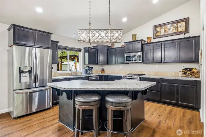 Gourmet kitchen well designed with tons of counter and cabinet space.  Eating bar perfect for entertaining.
