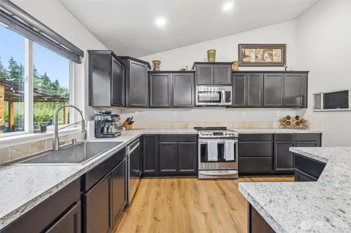 Light and bright. Great views of back yard and outdoor living from the kitchen.