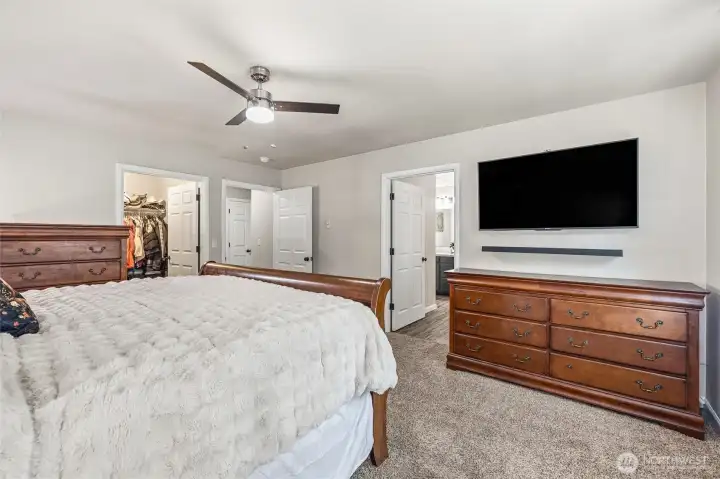 Walk in closet through left door.  Door on right leads to large primary bath.