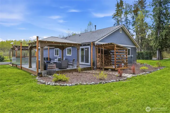 Deck runs length of back of home.  Wood storage conveniently located just off back slider.