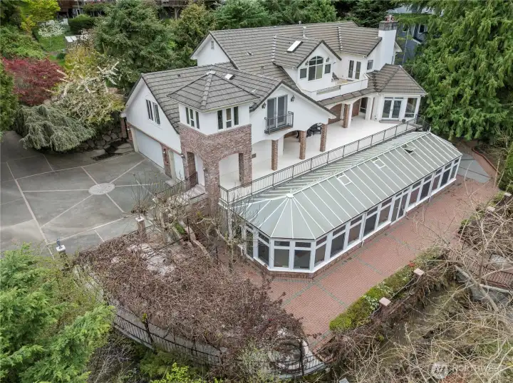 Beautiful & timeless home on Mercer Island's West side. Incredibly private being surrounded by nature. Gorgeous atrium with in ground pool. Elegantly appointed amenities, an abundance of storage throughout & lots of outdoor living space.