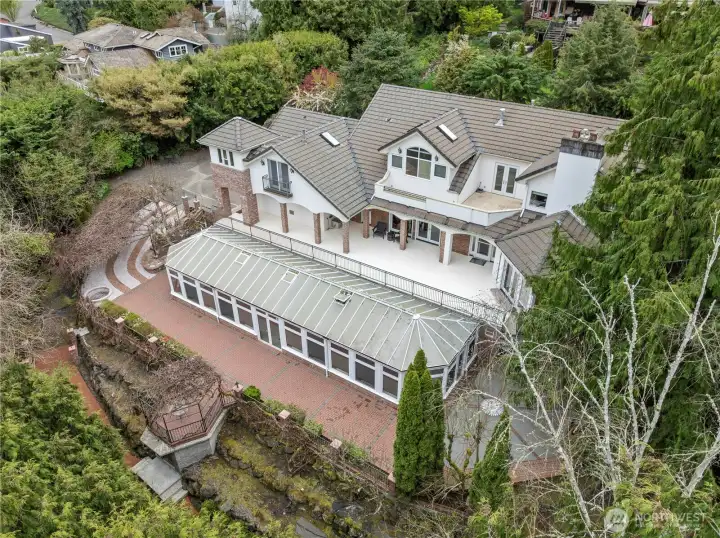 Extensive, custom brickwork handlaid by Spanish artisans. Expansive outdoor living & entertaining space.