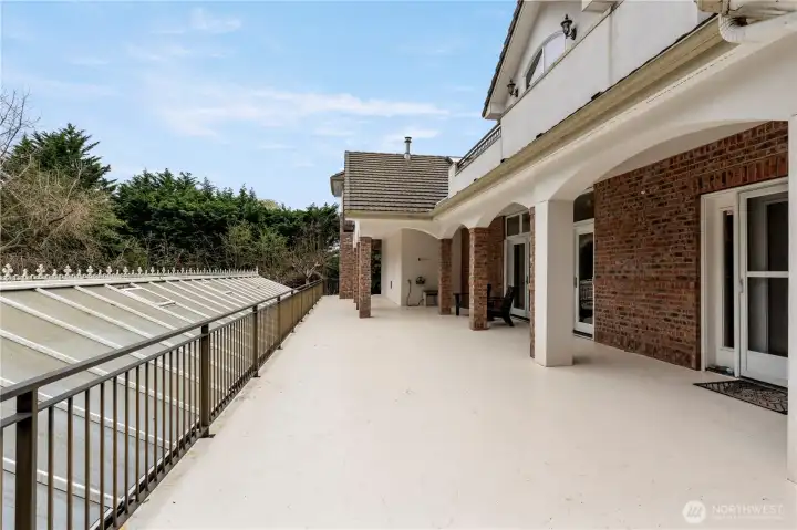Spacious patio & entertaining space. 2 sets of French doors open up from the dining room & can spill out on the patio. Front door is just to the right in this photo