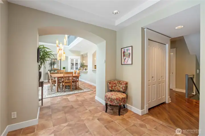 The heated tile floors extend from the entry into the dining room.