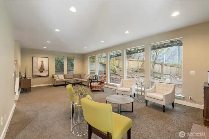 Big picture windows let in wonderful natural light &  look out onto the gorgeous brick patio.