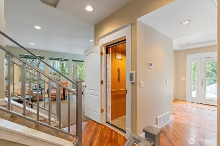 Don't worry about the stairs in this home-it has an elevator! It will take you to all 3 floors.