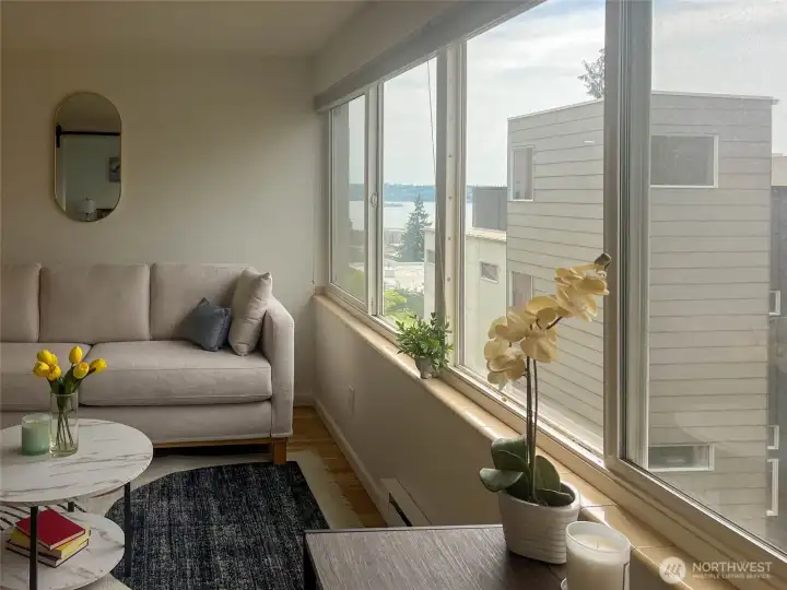 The windows in the living room and bedroom offer stunning peek-a-boo views of Elliott Bay.