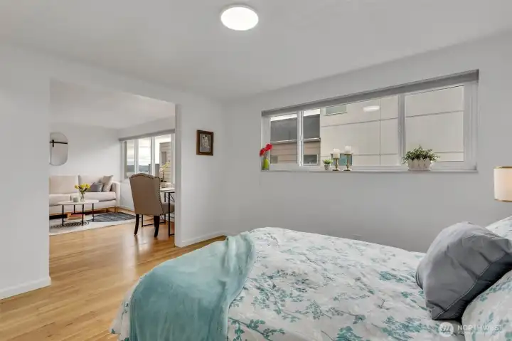 The bedroom can be open to the living room or closed. There are two barn doors adjacent to the living room and another one to the hallway.