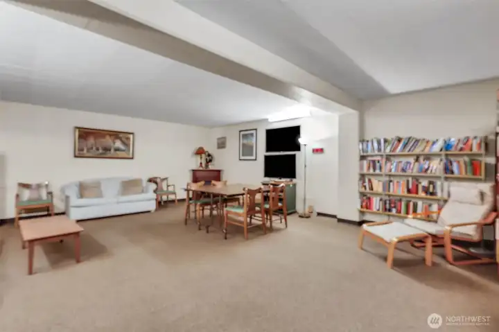 Across the hall from the community kitchen is this social room. This media/rec room has a library, games, and videos and is available on a casual basis, for special occasions, or brief overnight guest visits.