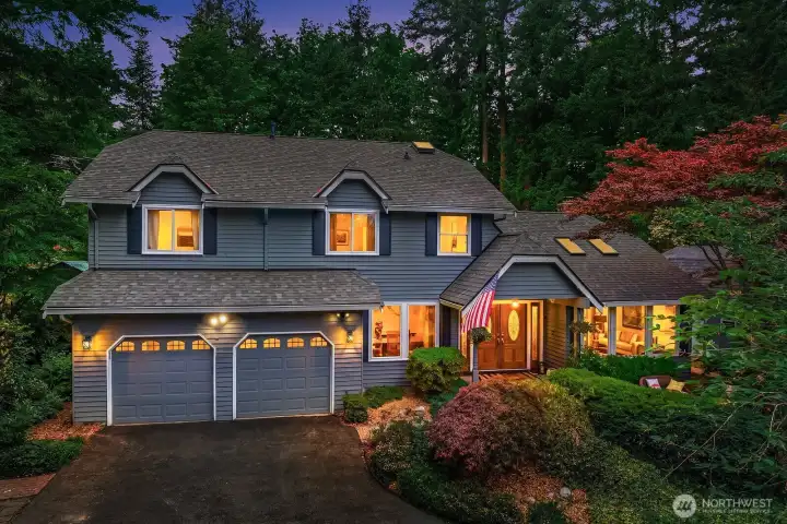Nestled on a shy three-quarter acre cul-de-sac lot in Sammamish's coveted Pine Lake area, this stunning home captivates from the moment you arrive with gorgeous mature landscaping, a welcoming front patio, and a breathtaking natural backdrop.