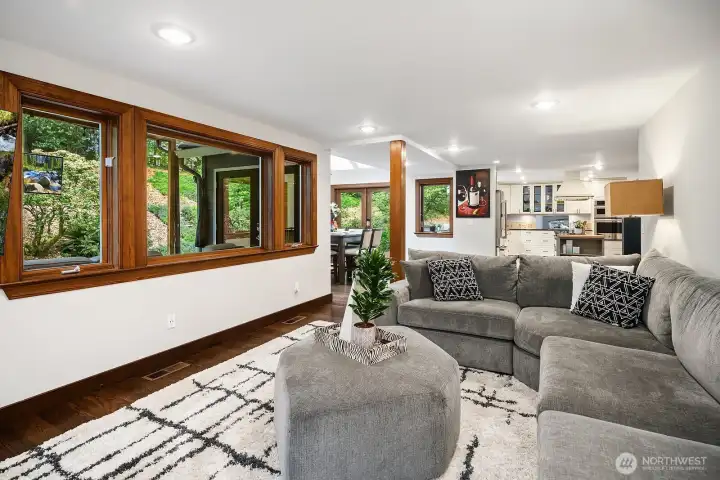 Another view of the family room showcases the open sightlines connecting to the kitchen and dining areas, creating an effortless flow perfect for both relaxed evenings and larger gatherings.