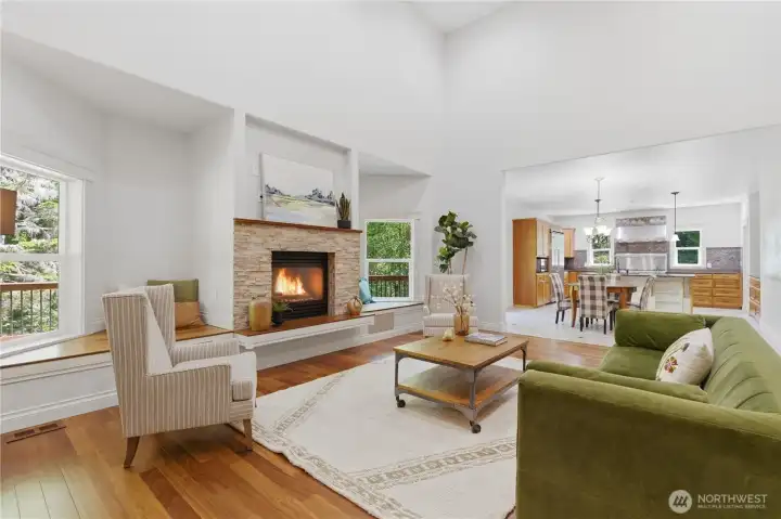 Family room with vaulted ceilings and gas fireplace. Home is staged.