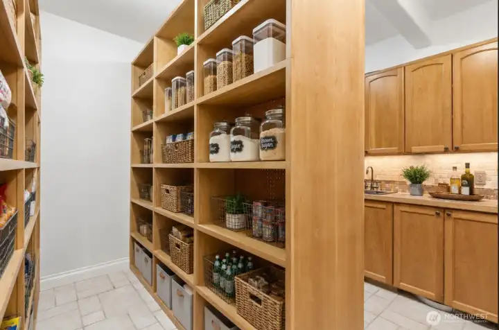 Walk-in pantry and butler pantry. Virtually staged.