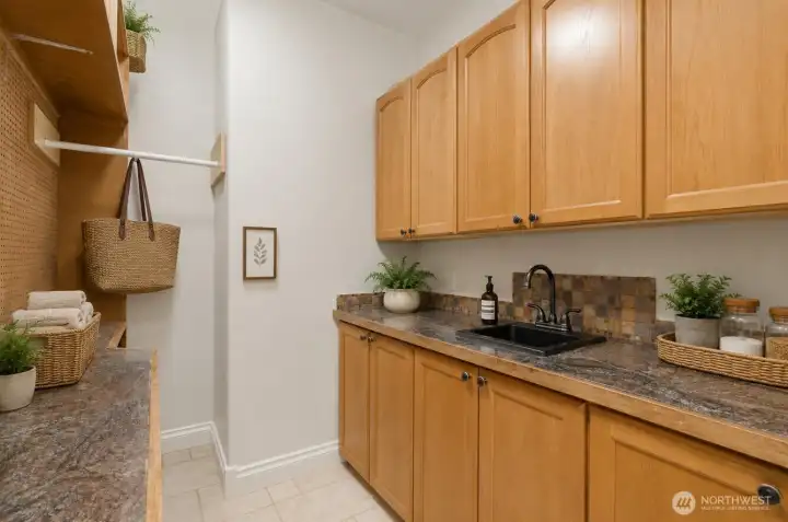 Walk-in pantry and butler pantry. Virtually staged.
