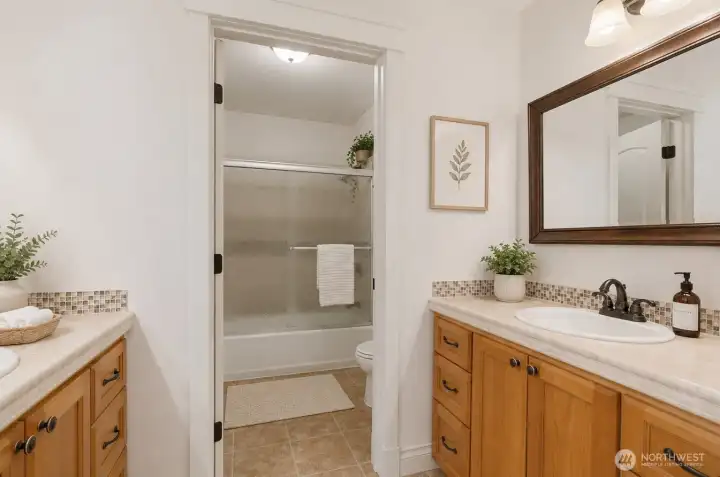 Upstairs bathroom. Virtually staged.