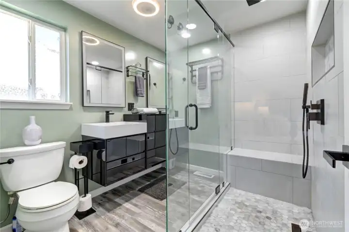 Spectacular $40K primary bath remodel featuring new skylights, custom glass shower, new LVP flooring, a luxury vanity, new LED lighting and heated mirrors. Spectacular $40K primary bath remodel featuring new skylights, custom glass shower, new LVP flooring, a luxury vanity, new LED lighting and heated mirrors.